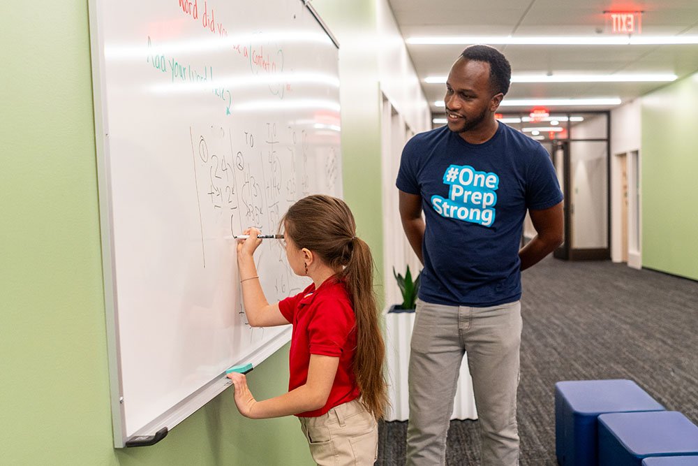 Teacher working with student