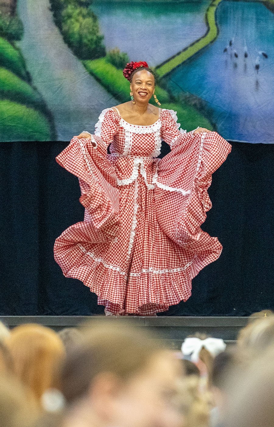 A woman dancing in a flowing dress