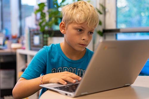 A boy on a laptop
