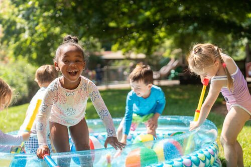 Young students playing in a pool