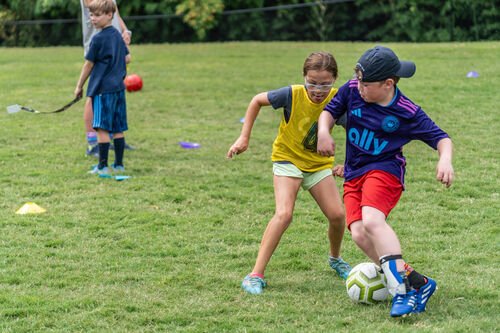 Students playing soccer
