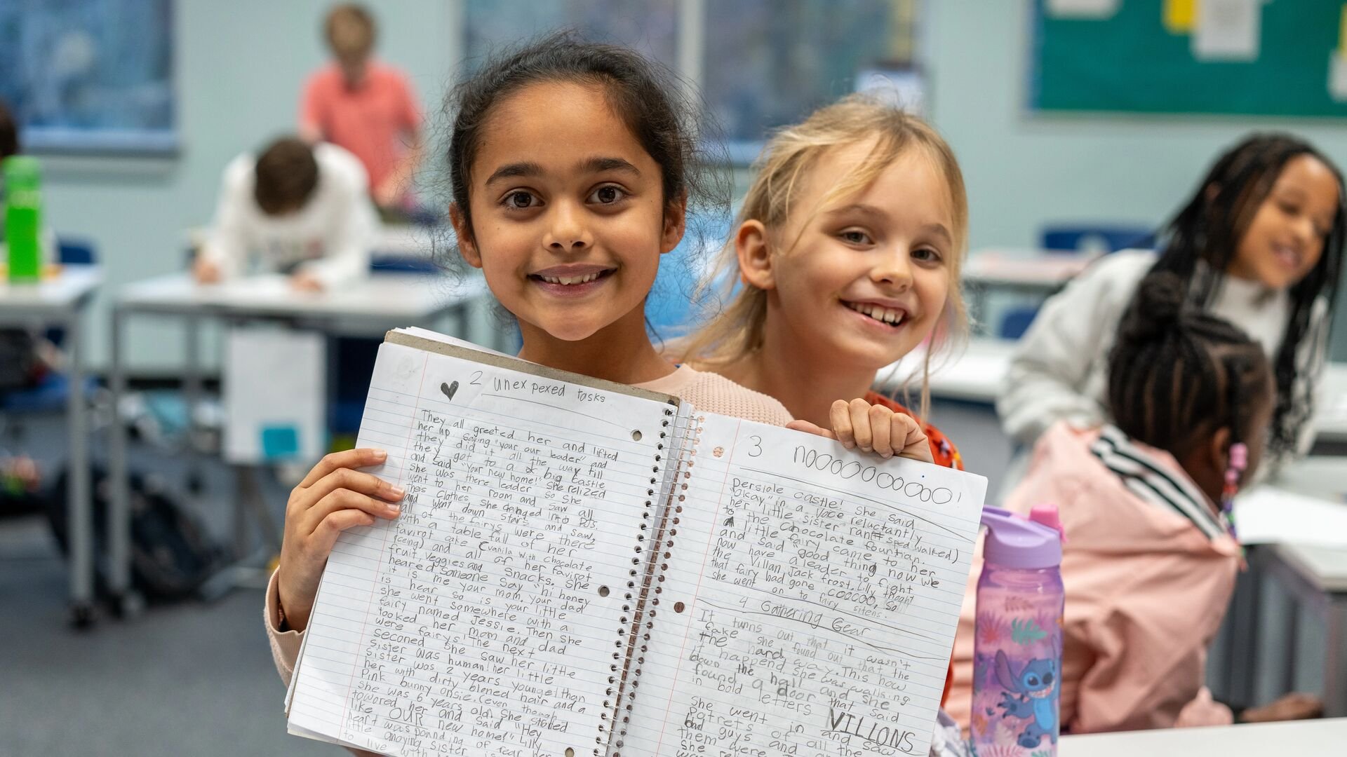 Students show of their writing