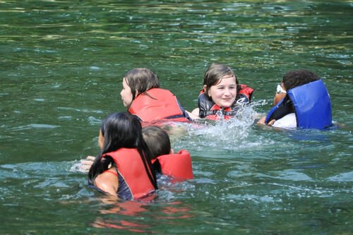 Students swim in lake