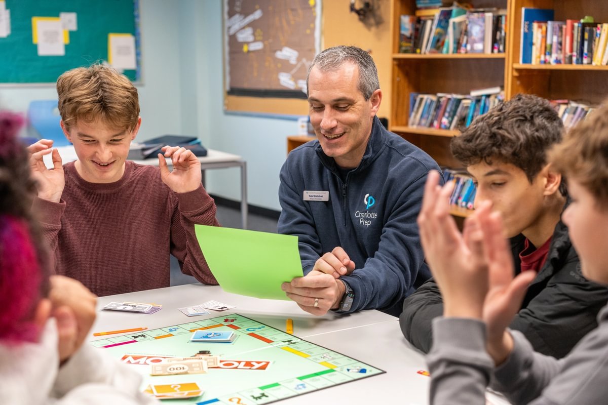 Students playing a game with Mr. Ballaban