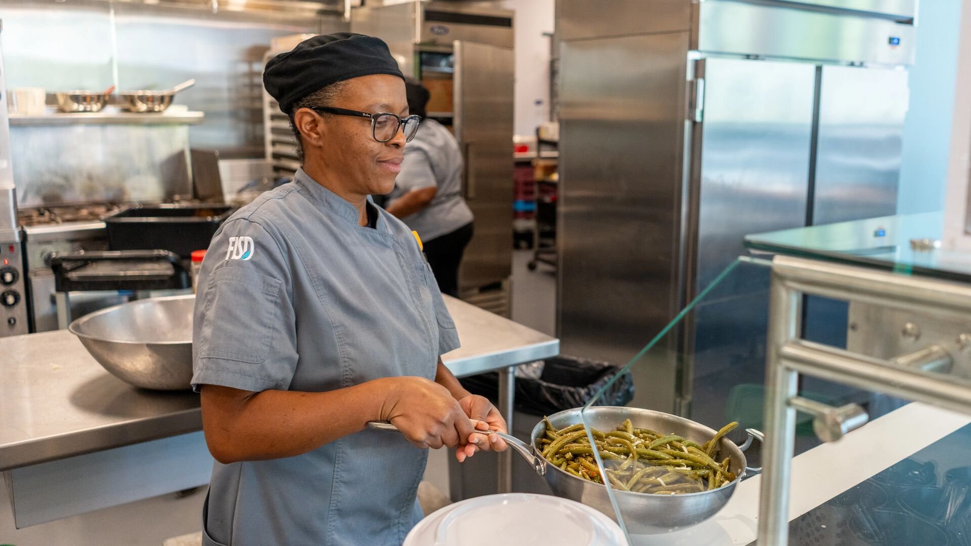 Chef serves green beans